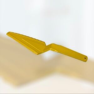 Vintage Tupperware gold pie or cake server